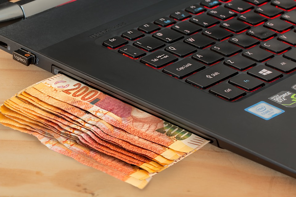 money under the laptop